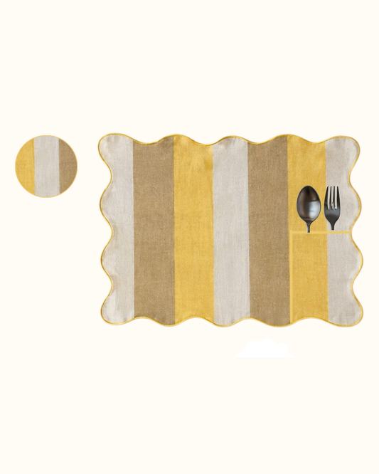 Miso Butter linen set of eight, four placemats and four coasters in mustard through cream into deep ochre, piped in butter yellow.