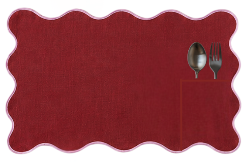 Cab Sauv linen placemat, deep wine red with soft pink piping, wavy edge and a pocket for cutlery.