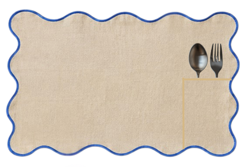 Roquefort linen placemat, cream with deep blue piping, wavy edge and a pocket for cutlery.