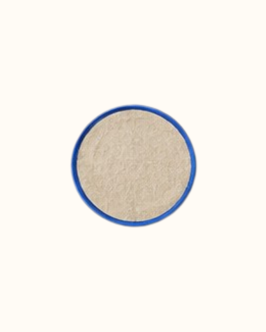 Four round linen coasters in Roquefort, cream linen piped in deep blue.